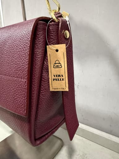 Borsa bordeaux in pelle con manico intrecciato