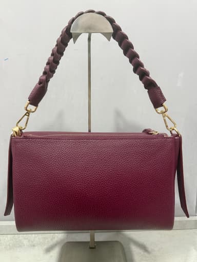 Borsa bordeaux in pelle con manico intrecciato